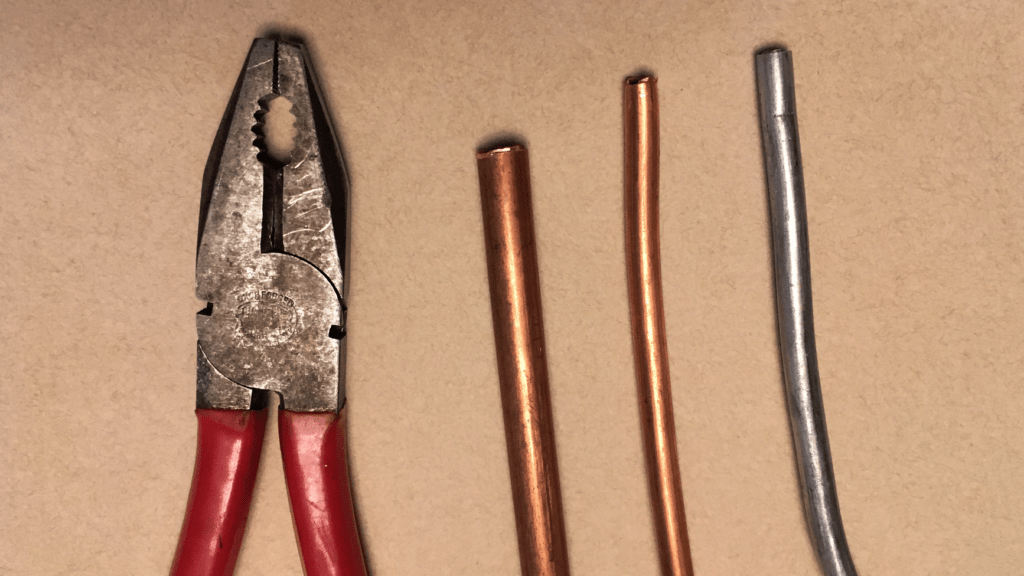 Copper (and aluminum) tubing, with pliers for scale.