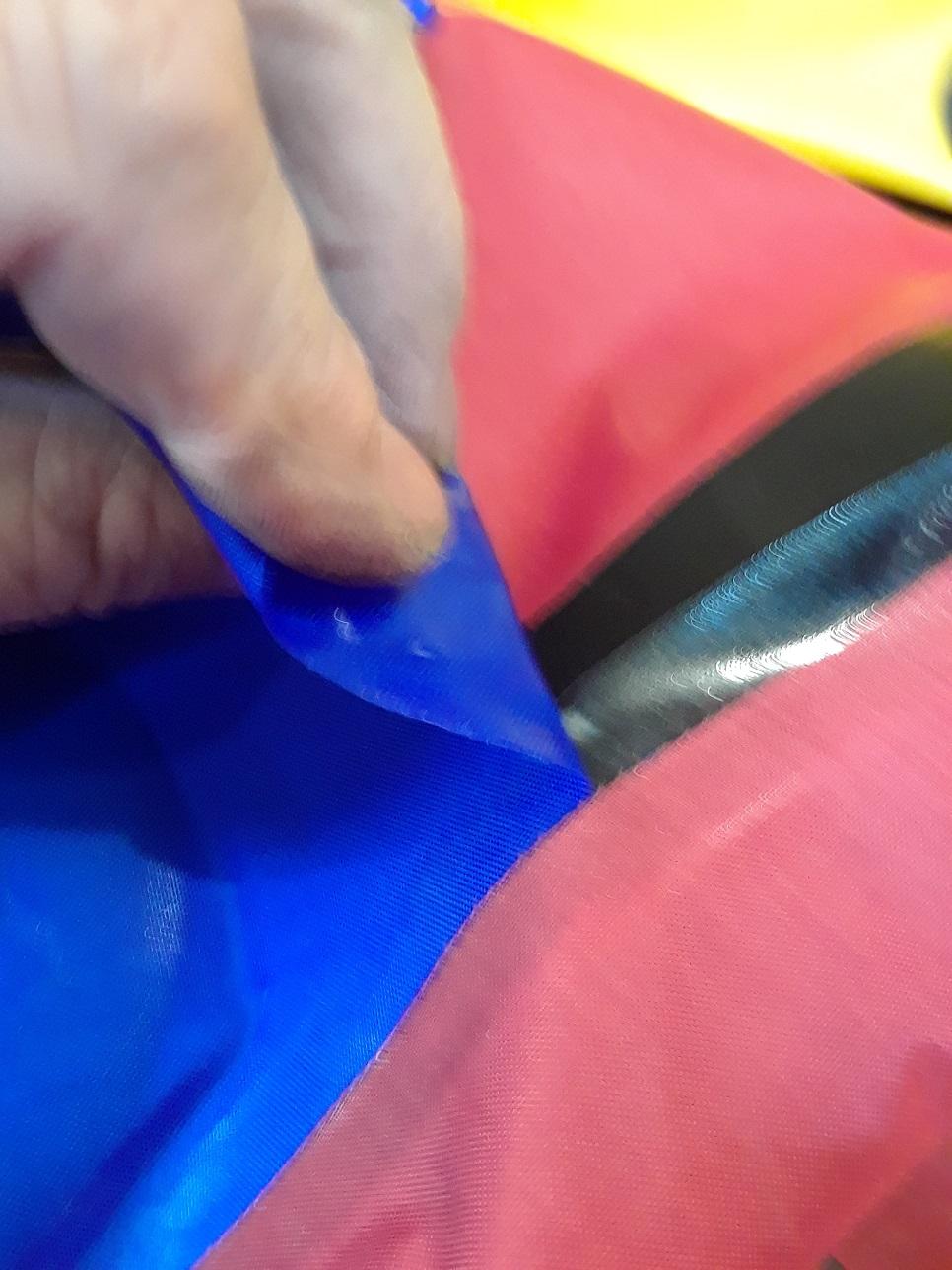 Peeling the blue off the black seam strip