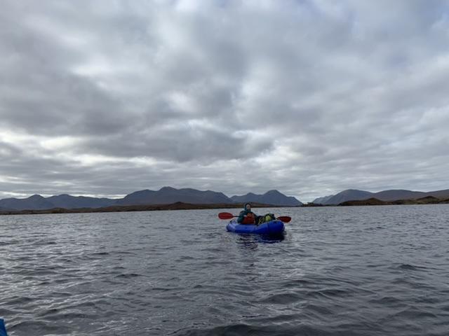 Paddling the Lochs back to Rannoch. Glen Coe in the background 