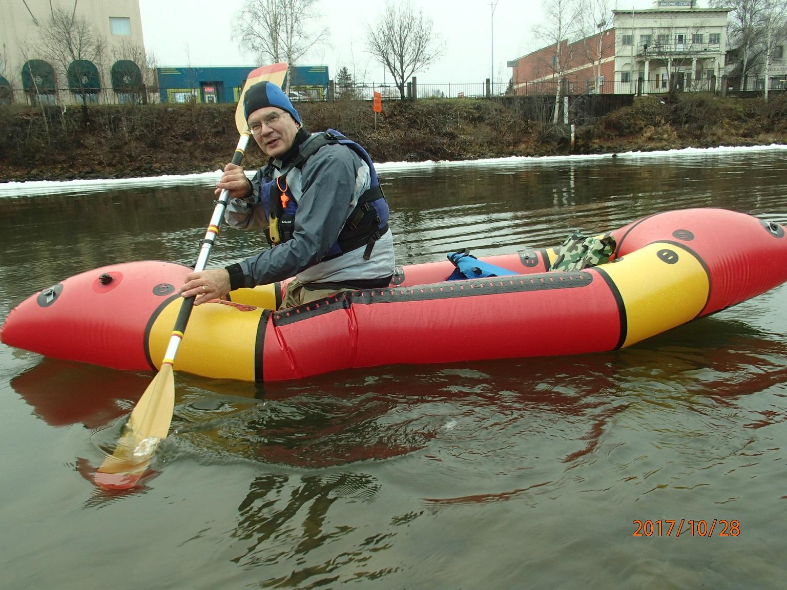 Tandem on the Chena River, leaning forward into the front of the raft.